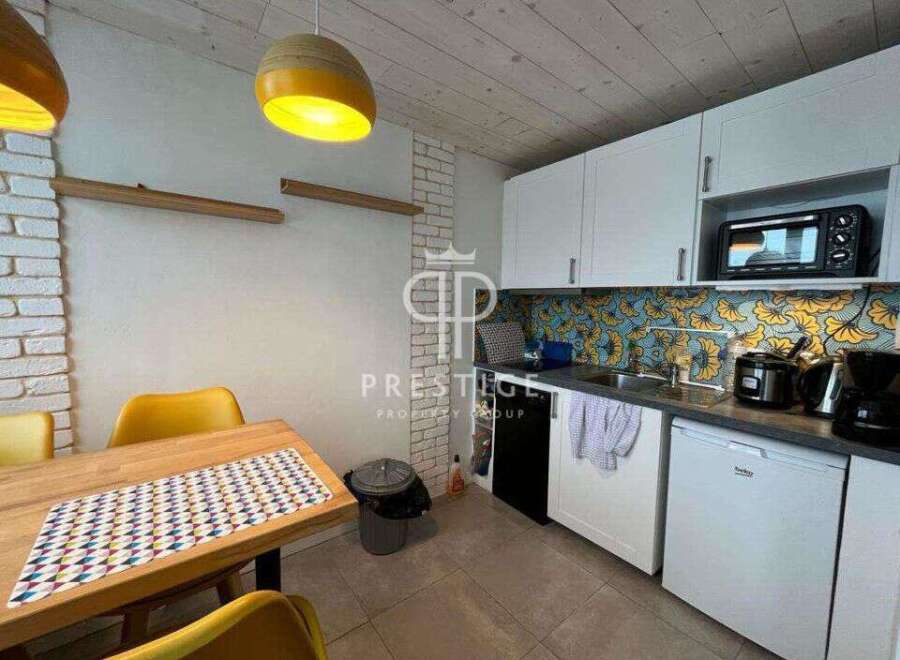 Discover this charming property featuring a well-equipped kitchen with modern appliances and stylish cabinetry.
