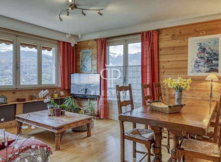 Experience the charm of this cozy property, featuring stunning wooden interiors and breathtaking mountain views.