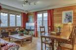 Experience the charm of this cozy property, featuring stunning wooden interiors and breathtaking mountain views.