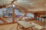 Discover the charm of this unique property with its exposed wooden beams and cozy attic space.