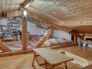 Discover the charm of this unique property with its exposed wooden beams and cozy attic space.