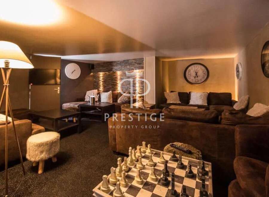 Discover luxury living at its finest! This stunning property boasts a cozy lounge area, perfect for relaxation and entertainment.
