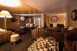 Discover luxury living at its finest! This stunning property boasts a cozy lounge area, perfect for relaxation and entertainment.