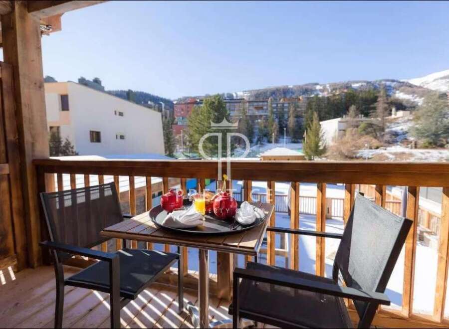 Enjoy breathtaking mountain views from this charming balcony.