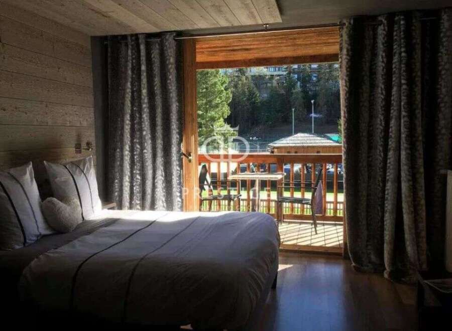 Experience the charm of this cozy bedroom with a stunning view.