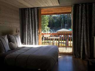 Experience the charm of this cozy bedroom with a stunning view.