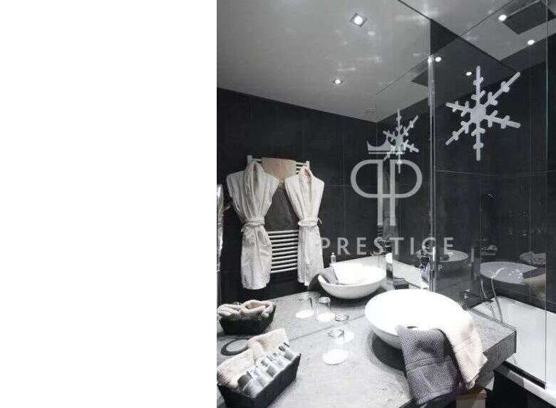 Indulge in luxury at this stunning property, featuring a modern bathroom design.