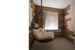 Relax in style with this unique property featuring a cozy hanging chair.