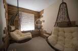 Relax in style with these unique hanging chairs, perfect for unwinding after a long day.