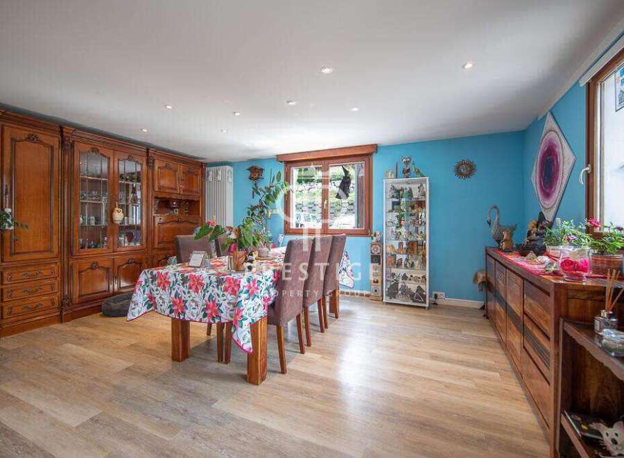 This stunning property boasts a spacious dining area, perfect for hosting gatherings.
