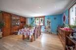 This stunning property boasts a spacious dining area, perfect for hosting gatherings.