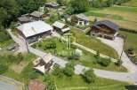 Discover a charming village nestled in a picturesque landscape, featuring stunning homes with unique architectural designs.
