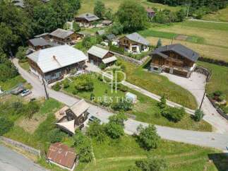 Discover a charming village nestled in a picturesque landscape, featuring stunning homes with unique architectural designs.