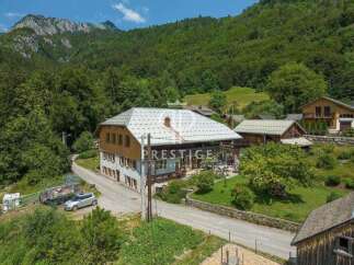 Discover a stunning property nestled in a picturesque mountain setting.