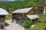 Discover a charming property nestled in a picturesque mountain setting.