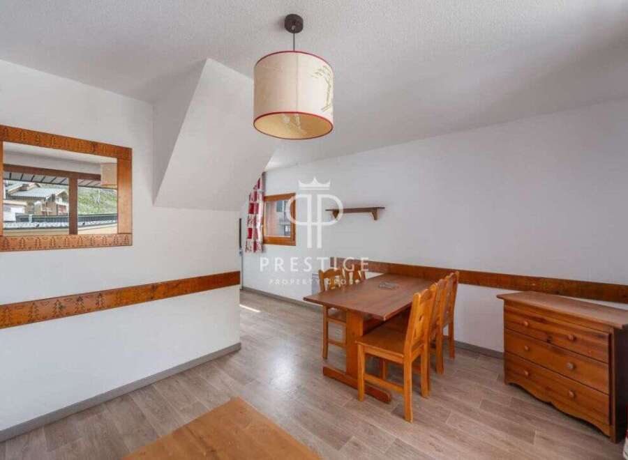 Discover a charming property with a cozy dining area, perfect for intimate gatherings.