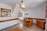 Discover a charming property with a cozy dining area, perfect for intimate gatherings.