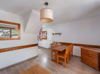 Discover a charming property with a cozy dining area, perfect for intimate gatherings.