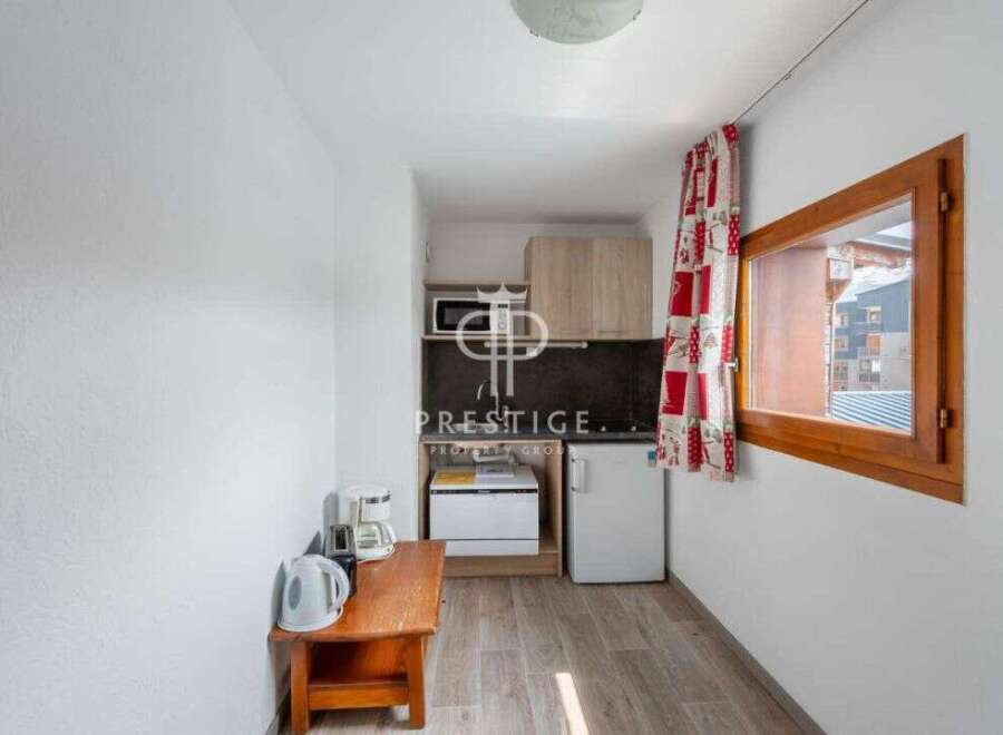 Cozy studio apartment with a well-equipped kitchenette, perfect for a comfortable stay.