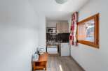 Cozy studio apartment with a well-equipped kitchenette, perfect for a comfortable stay.