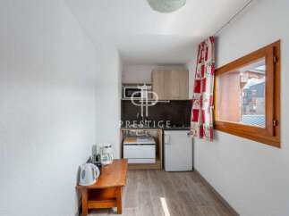Cozy studio apartment with a well-equipped kitchenette, perfect for a comfortable stay.