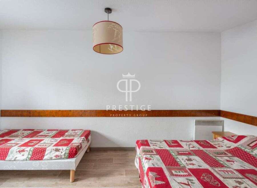 Discover a cozy bedroom with two comfortable beds, perfect for a relaxing stay.