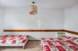 Discover a cozy bedroom with two comfortable beds, perfect for a relaxing stay.