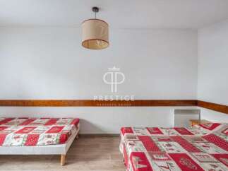 Discover a cozy bedroom with two comfortable beds, perfect for a relaxing stay.