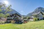 Discover a charming property nestled in a picturesque mountain setting.