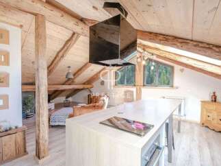 Discover the charm of this stunning property, featuring a rustic interior with exposed wooden beams and a cozy atmosphere.