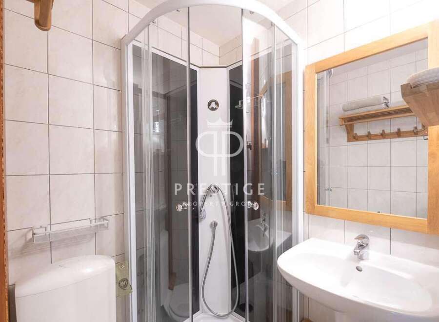 Discover a modern bathroom with a sleek shower enclosure.