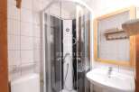 Discover a modern bathroom with a sleek shower enclosure.