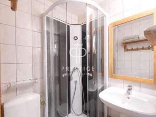 Discover a modern bathroom with a sleek shower enclosure.