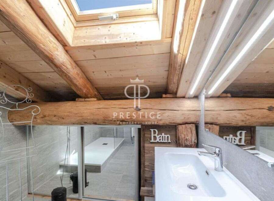 Discover the charm of this property, featuring a unique wooden beam ceiling and a skylight that floods the space with natural light.