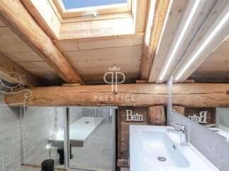 Discover the charm of this property, featuring a unique wooden beam ceiling and a skylight that floods the space with natural light.