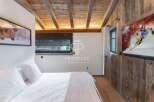 Experience rustic elegance in this stunning bedroom.