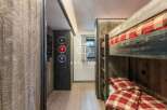 Discover a cozy retreat with this charming bunk bed setup.