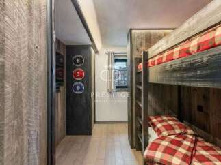 Discover a cozy retreat with this charming bunk bed setup.