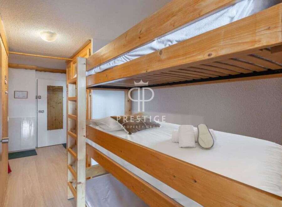Cozy bunk beds offer a comfortable sleeping arrangement, perfect for families or groups.