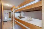 Cozy bunk beds offer a comfortable sleeping arrangement, perfect for families or groups.