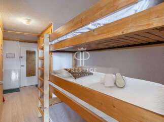 Cozy bunk beds offer a comfortable sleeping arrangement, perfect for families or groups.