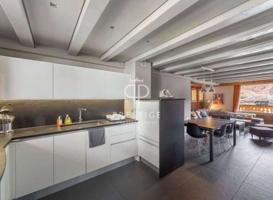 Discover modern living in this stunning property, featuring a sleek kitchen with contemporary design.