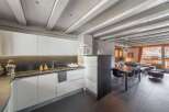 Discover modern living in this stunning property, featuring a sleek kitchen with contemporary design.