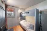 Cozy bedroom featuring a bunk bed, perfect for accommodating guests or family.
