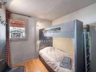 Cozy bedroom featuring a bunk bed, perfect for accommodating guests or family.