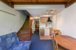 Discover this charming property featuring a cozy living space and a functional kitchen.