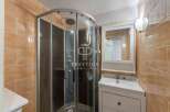 Discover a modern bathroom with a sleek shower enclosure.