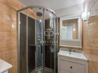 Discover a modern bathroom with a sleek shower enclosure.
