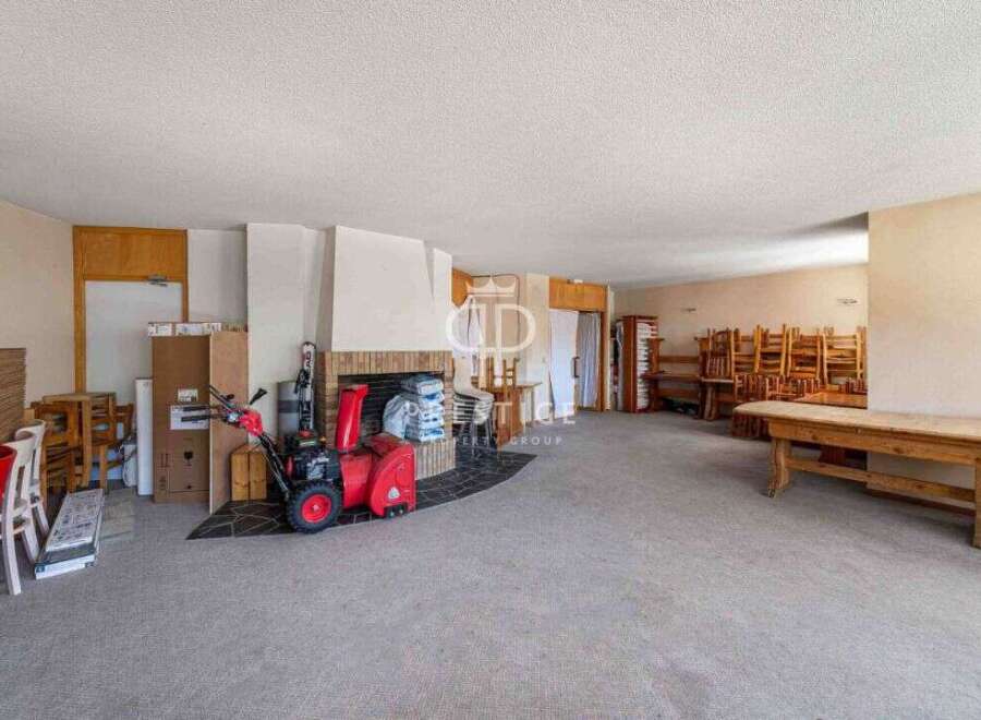 Spacious interior with a cozy fireplace, perfect for gatherings.