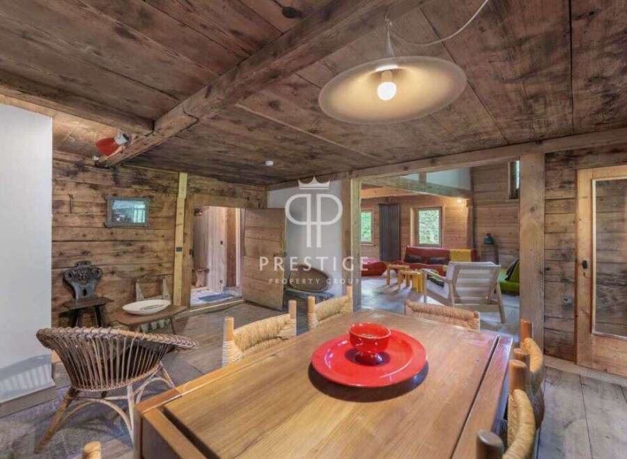 Discover rustic charm in this stunning property, featuring exposed wooden beams and walls that exude warmth.